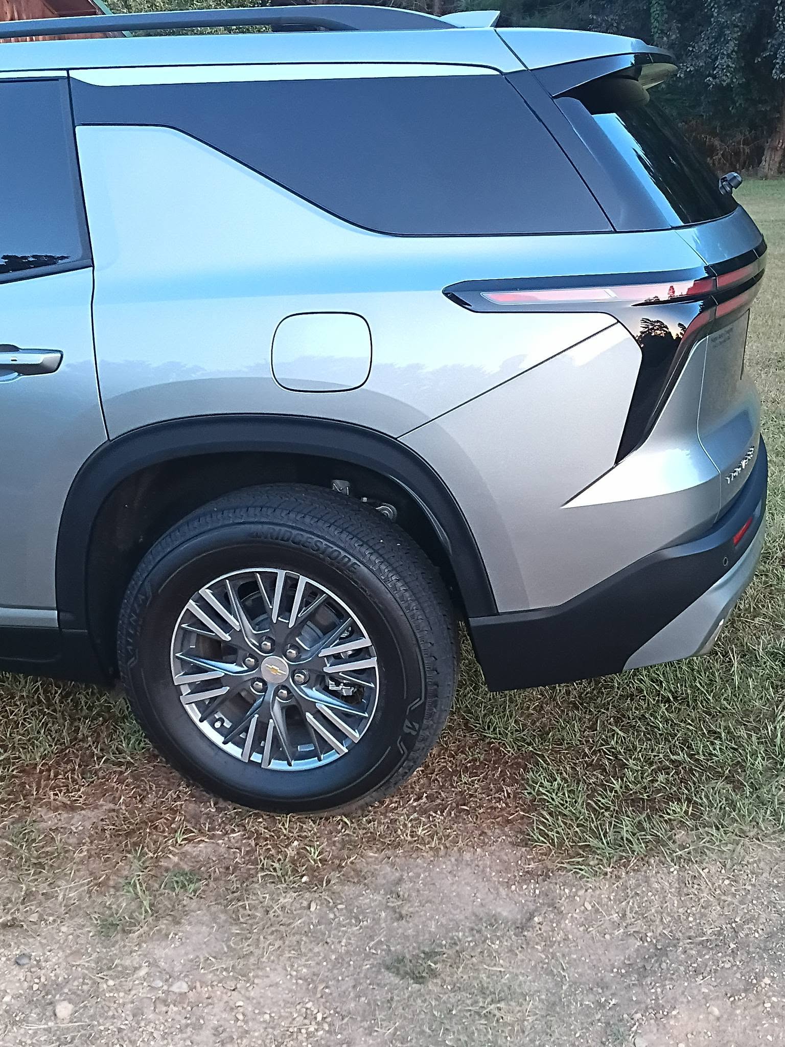 Detailed silver Chevrolet SUV rear quarter